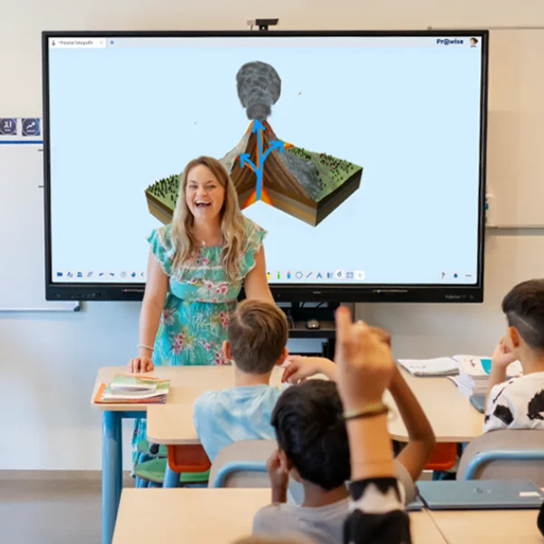 teacher at front of class before display