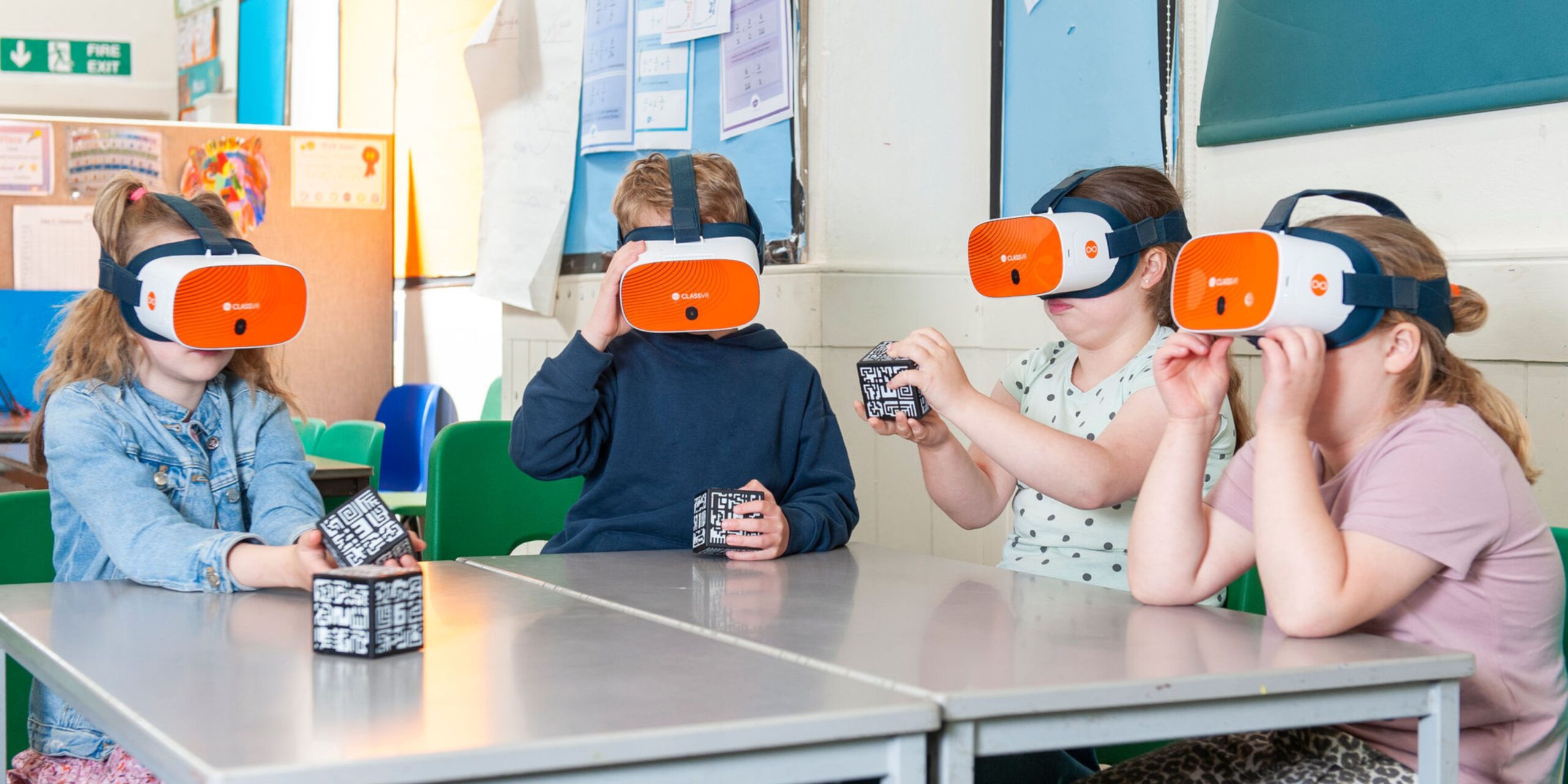 children exploring ClassVR Xplorer headsets 