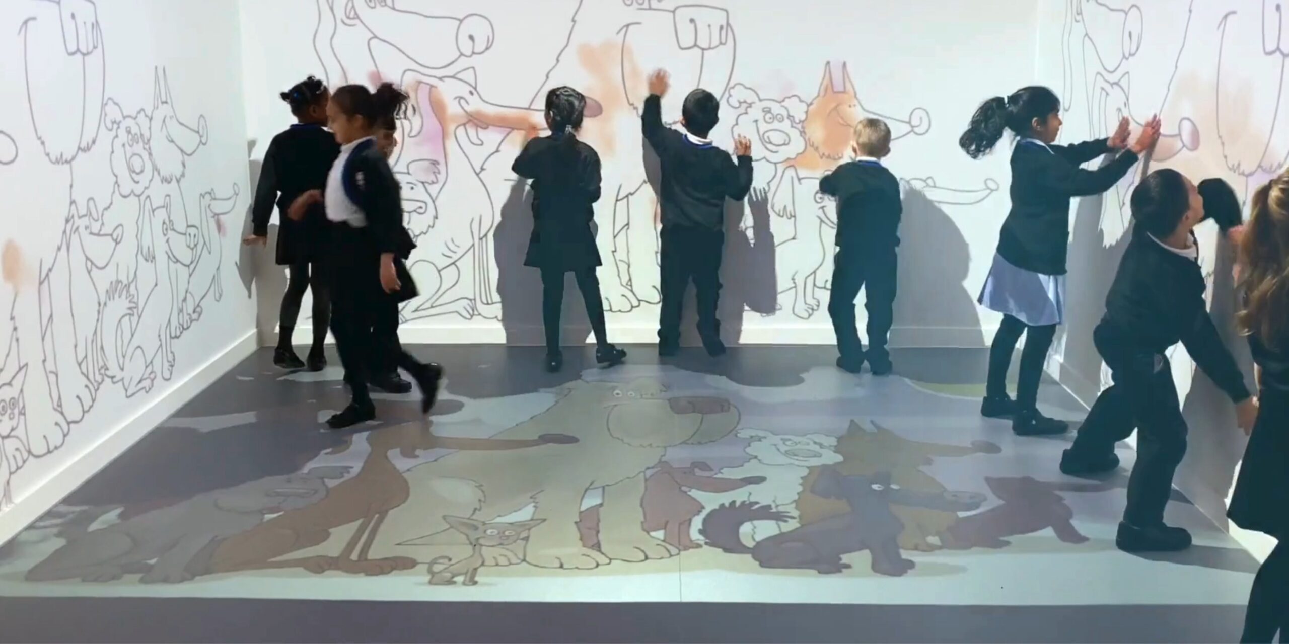 What is the process of installing an immersive classroom? 2 Children interacting with walls in immersive classroom